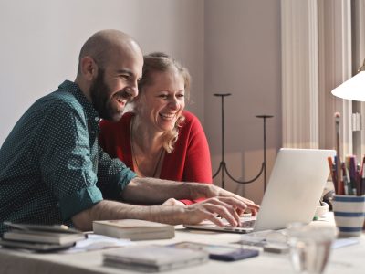 couple at home working on computer